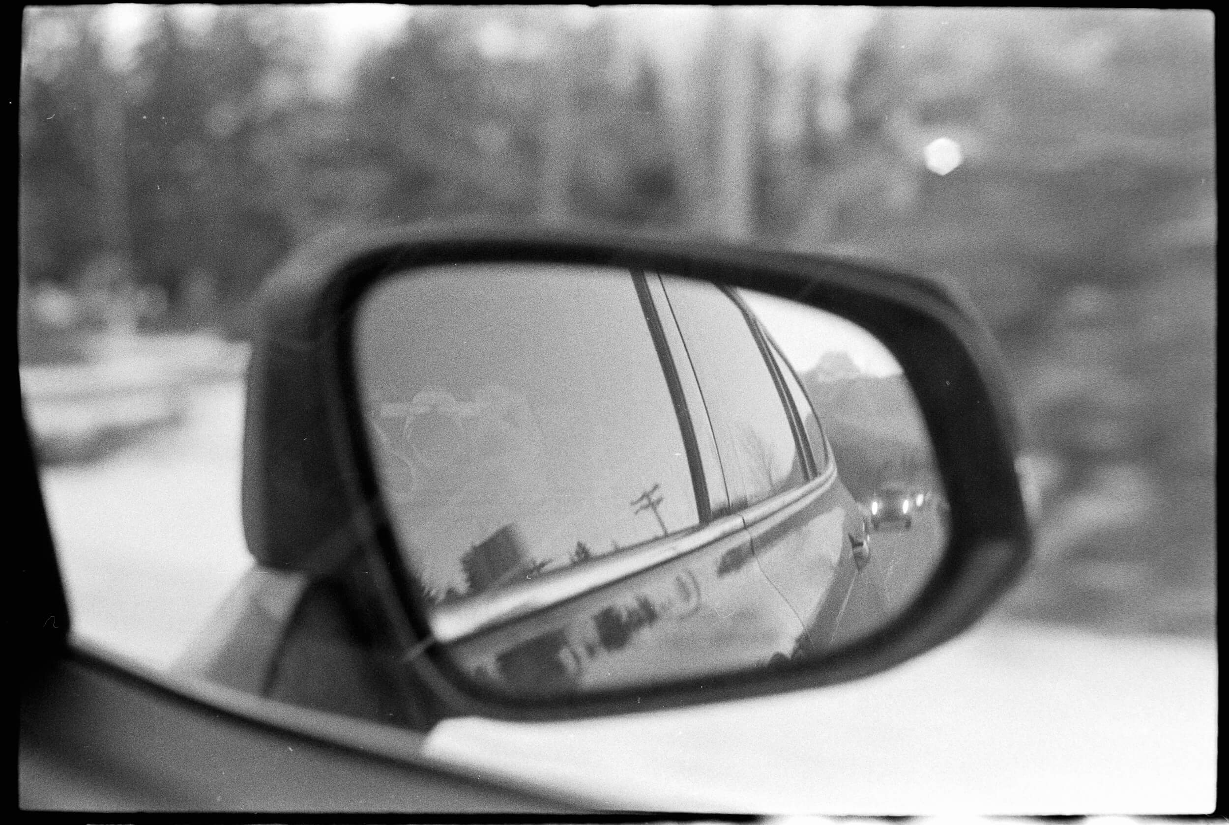 Reflection in the Car Mirror